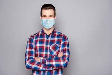Portrait of his he attractive content guy wearing gauze mask folded arms vaccine preventive measures cov ncov infection influenza China Wuhan isolated over grey pastel color background