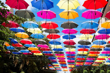 Colorful umbrellas background. Colorful umbrellas in the sky. Street decoration.