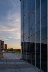 building with business offices. Glass wall in a city.