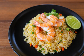 Thai Food - Fried rice with shrimp on wooden background