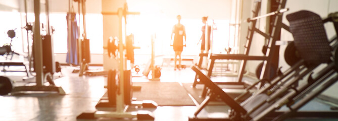 Blurred of fitness gym background for banner presentation.