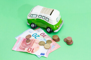 A lot of money saved to spend the holidays. Banknotes and coins next to the piggy bank