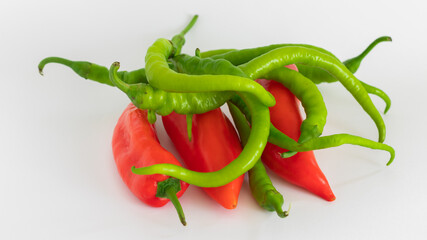 red and green peppers on white