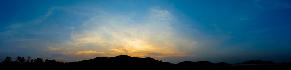 Fototapeta premium Dramatic sky with silhouette of mountain