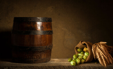 Beer style- bottle, beer in the glass and covers on wooden table. Free space for text. Top view