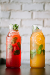 Glass jars with fresh fruit lemonade
