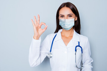 Close-up portrait of her she attractive lovely content girl doc medic showing ok-sign disease...