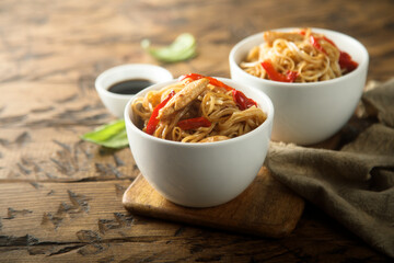 Fried rice noodles with chicken and pepper