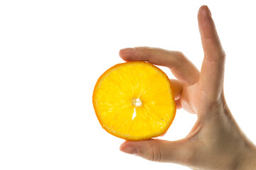 Hand holds a slice of orange on a white background isolate
