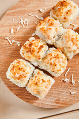 Baked shrimp rolls on wooden board top view