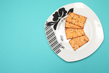 cookies on the plate,view of top isolated on blue background