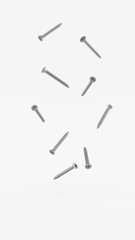 Metal screws vertical background, metallic screw head equipment. Many silver bolts flying in the air, construction tools background. Steel chrome bolt, grey instruments minimalist concept.