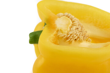 Macro close up shot of a yellow bell pepper isolated on a white background