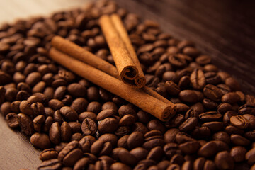 coffee, cinnamon on a brown background