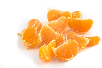 Satsuma Mandarine quarters isolated in a pattern on a white background,