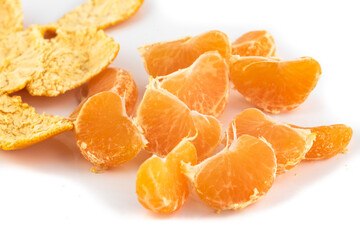 Satsuma Mandarine quarters isolated in a pattern on a white background,