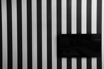 TV on the b&w striped wall