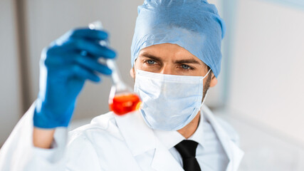 close up. medical flask in the hands of a laboratory assistant.