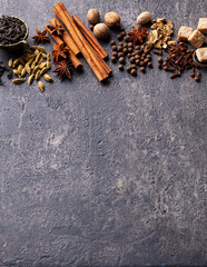 Spices for Indian masala tea. Grey background. Copy space.