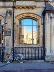 Bicycle against railing on Benet Street in Cambridge, United Kingdom