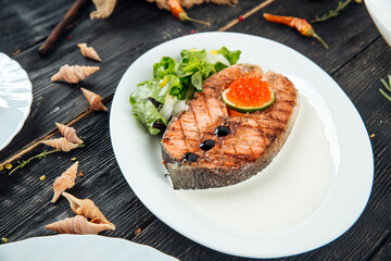 Grilled salmon fillet lime and red roe caviar 