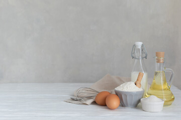 Ingredients for bakery butter flour, milk, oil, eggs, sugar, kitchen accessories