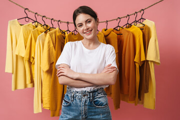 Photo of young cheerful woman smiling and looking at camera