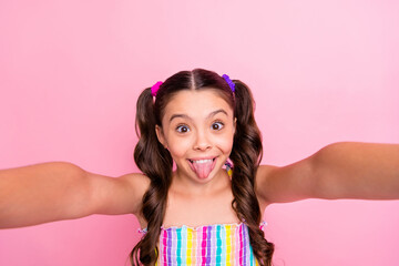 Closeup photo of beautiful funny little lady two long tails make selfies popular children blogger...