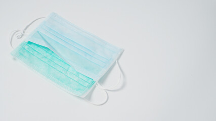 Disposable Ear- loop face mask on white background.