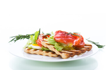 fried bread toast with salad leaves and salted red fish