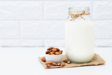 Milk Almonds in a glass on a white background
