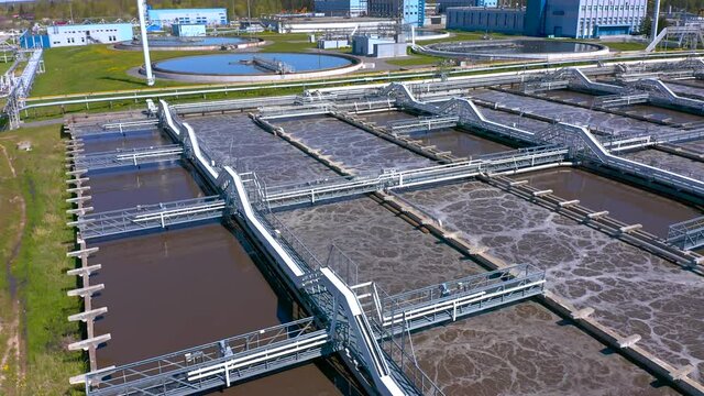 Aerial view of treatment facilities. Pumping station and drinking water supply. Industrial and urban water treatment for a big city. Iloskreb for round sedimentation tanks.
