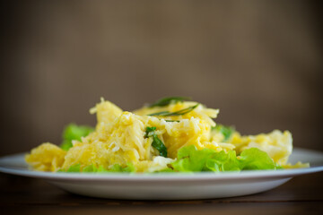 fried omelet with thin vermicelli with salad leaves in a plate
