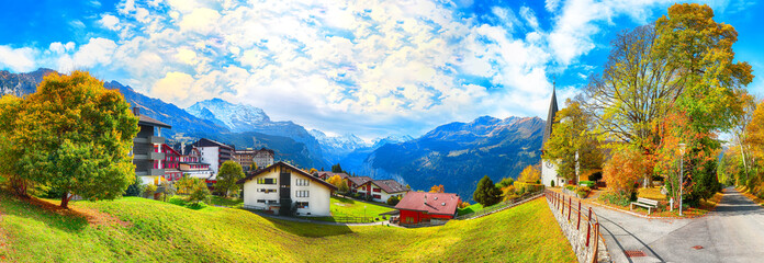 Awesome autumn view of picturesque alpine village Wengen.