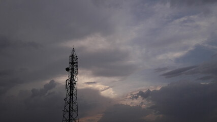 mobile phone tower in sunset