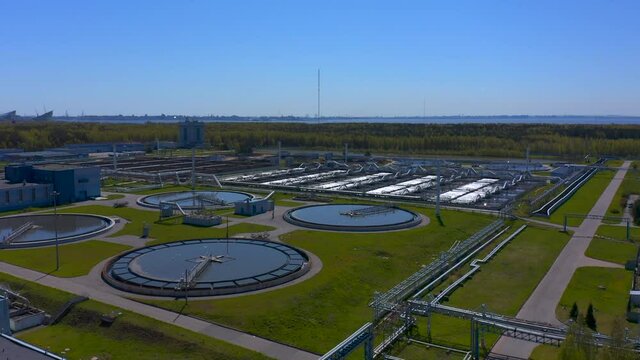Aerial view of treatment facilities. Pumping station and drinking water supply. Industrial and urban water treatment for a big city. Iloskreb for round sedimentation tanks.
