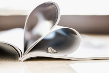 Wedding ring with a large diamond on the magazine.