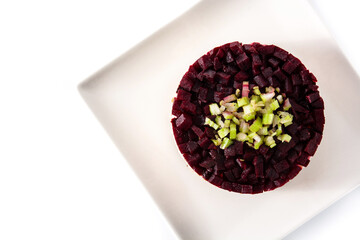 Traditional Russian herring salad with beetroot and carrots isolated on white background. Top view