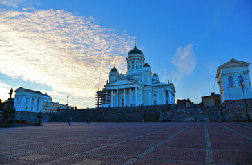 Main square with people, colorful old buildings, architecture and cloudy blue sky in front of...