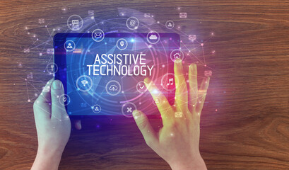 Close-up of a tablet with ASSISTIVE TECHNOLOGY inscription, innovative technology concept