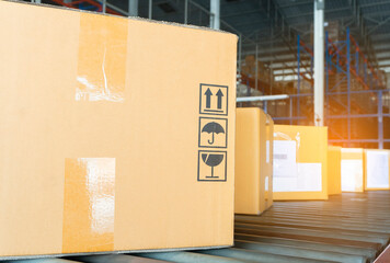 shipment boxes sorting on conveyor belt in distribution warehouse. 
