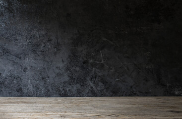 Old wood table on dark background.
