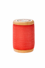 Colorful thread on a wooden spool. Isolated bobbin. White  isolated background. Retro style bobbin. Close up