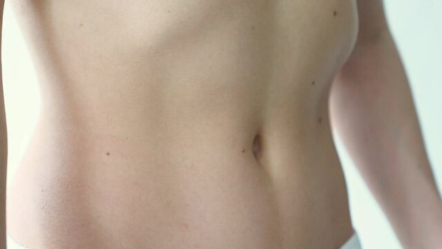beautiful athletic belly. inflated muscles of female press.