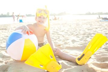 Cute child on the beach. Funny kid at summertime
