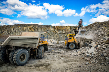 Production Mining of granite stone by quarrying machines in Mikashevichi