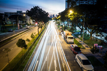 light trails of cars on a city road