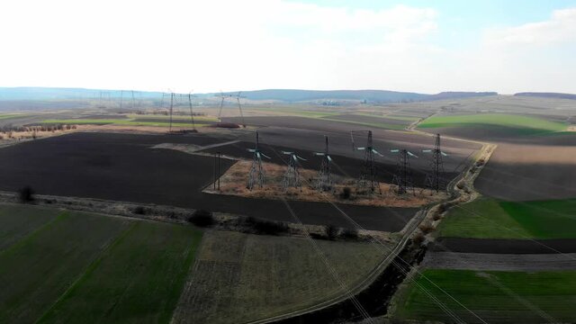 Flight over power lines. High voltage transmission lines of thousands of kilovolts