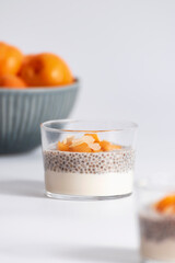 Chia seed pudding with apricot, almond and yogurt in glass. Clean eating, healthy vegan vegetarian...