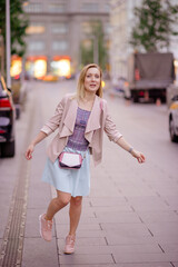 Beautiful young girl smiling on sunny street. Lifestyle Concept